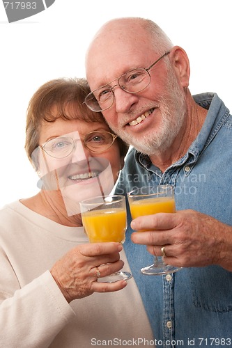 Image of Happy Senior Couple with Glasses of Orange Juice