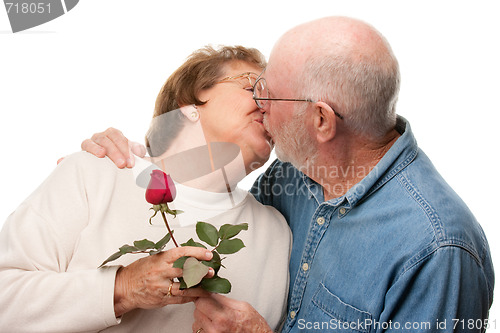 Image of Happy Senior Couple Kissing with Red Rose