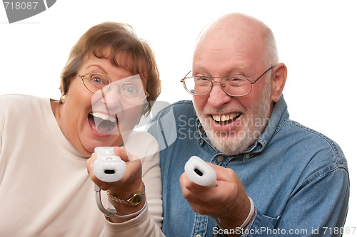 Image of Happy Senior Couple Play Video Game with Remotes