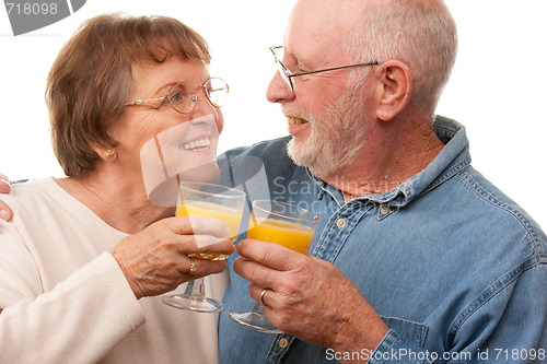 Image of Happy Senior Couple with Glasses of Orange Juice