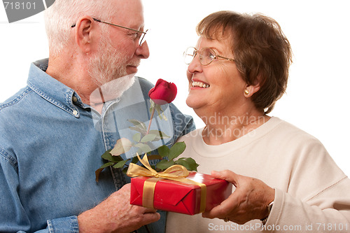 Image of Happy Senior Couple with Gift and Red Rose
