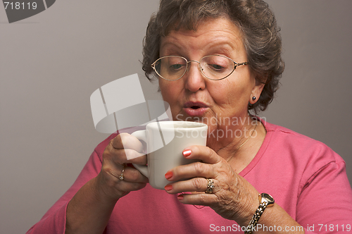 Image of Senior Woman Enjoys Her Coffee