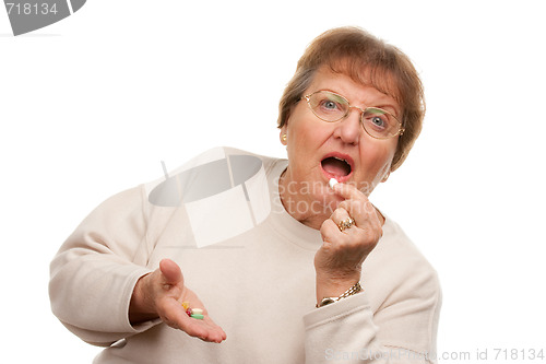 Image of Attractive Senior Woman Taking Pills

