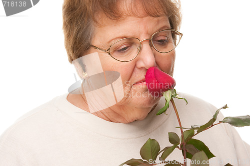 Image of Attractive Senior Woman with Red Rose
