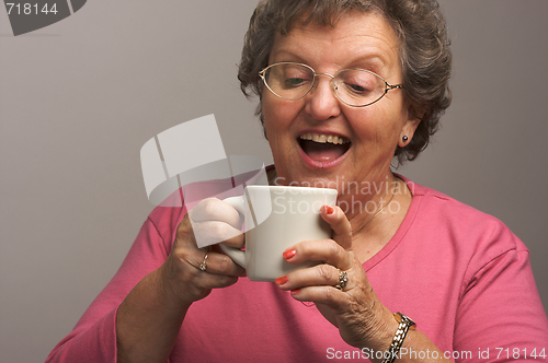 Image of Senior Woman Enjoys Her Coffee