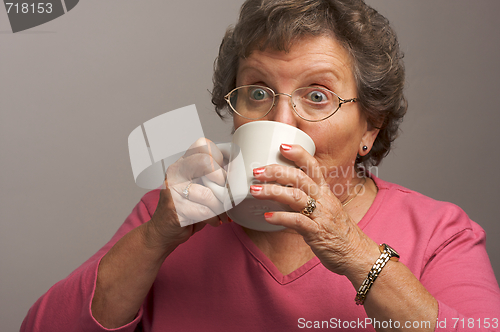 Image of Senior Woman Enjoys Her Coffee