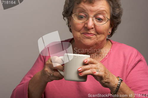 Image of Senior Woman Enjoys Her Coffee