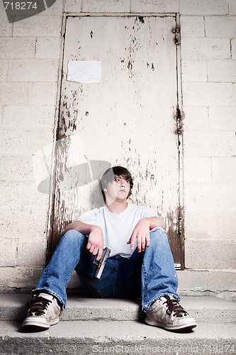 Image of teenager with handgun