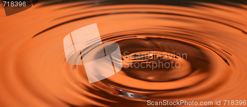 Image of water drop in orange tone 