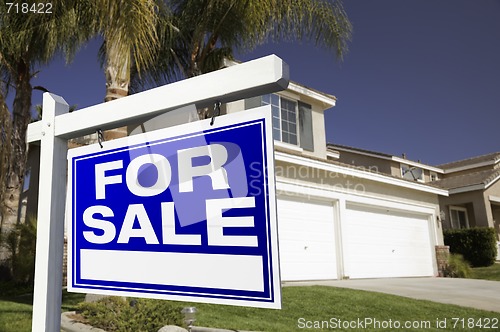 Image of For Sale Real Estate Sign and House