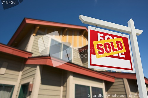 Image of Sold Home For Sale Sign in Front of New House 
