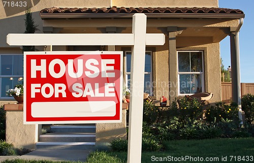 Image of Home For Sale Sign & New Home