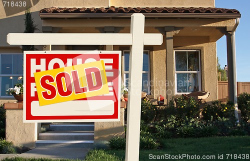 Image of Sold Home For Sale Sign in Front of New House 