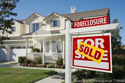 Image of Sold Foreclosure Home For Sale Sign and House