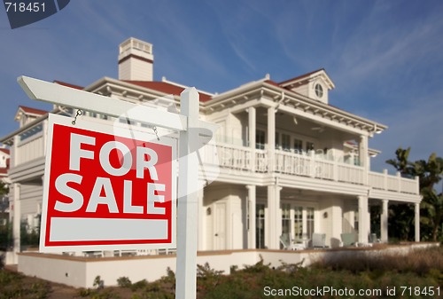 Image of Home For Sale Sign & New Home