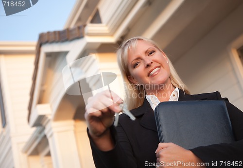 Image of Real Estate Agent Handing Over Keys to New Home