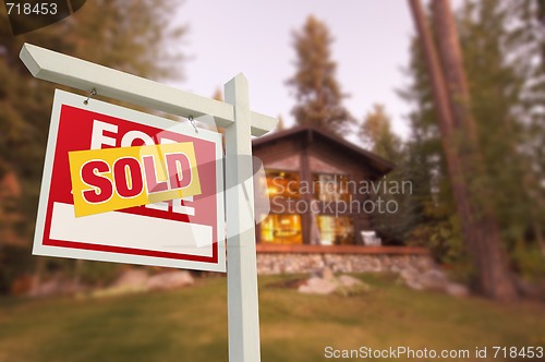 Image of Sold Home For Sale Sign and Beautiful Log Cabin