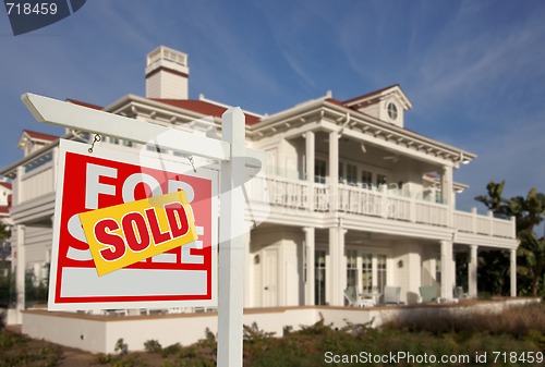 Image of Sold Home For Sale Sign in Front of New House 