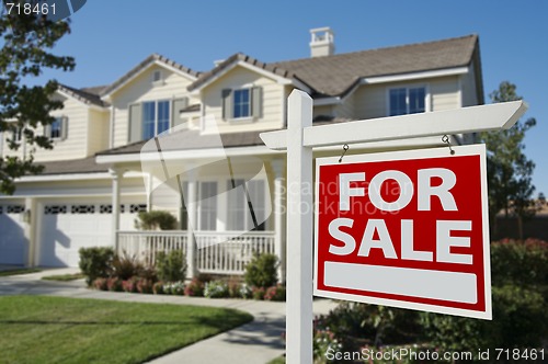 Image of Home For Sale Sign & New Home