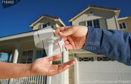 Image of Handing Over the House Keys in Front of New Home