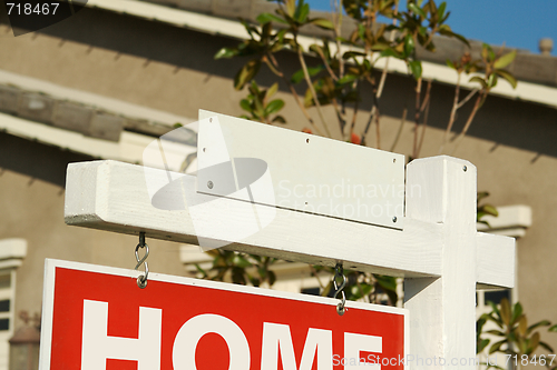 Image of Blank Real Estate Sign & New Home