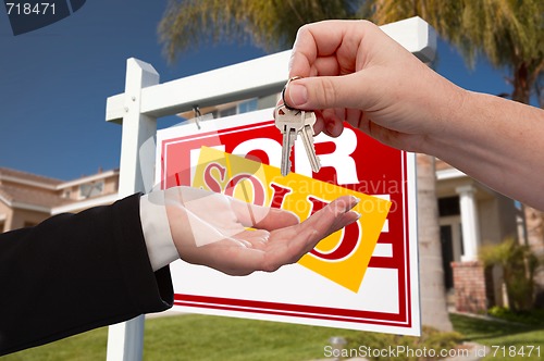 Image of Agent Handing Over the Key to a New Home