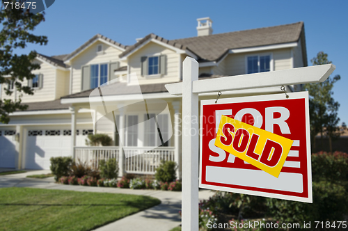 Image of Sold Home For Sale Sign in Front of New House 