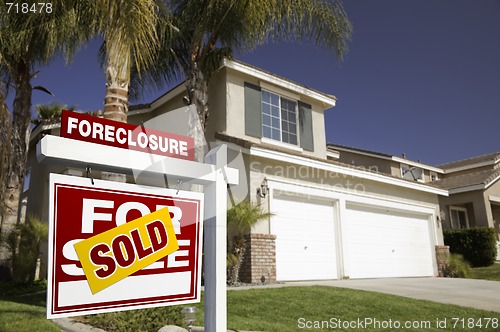 Image of Red Foreclosure For Sale Real Estate Sign and House