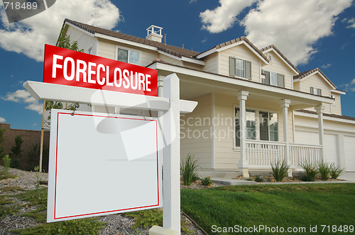 Image of Blank Foreclosure Real Estate Sign & New Home