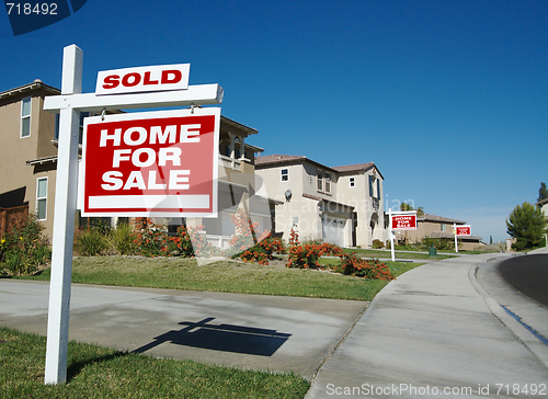 Image of Sold Home For Sale Sign & New House