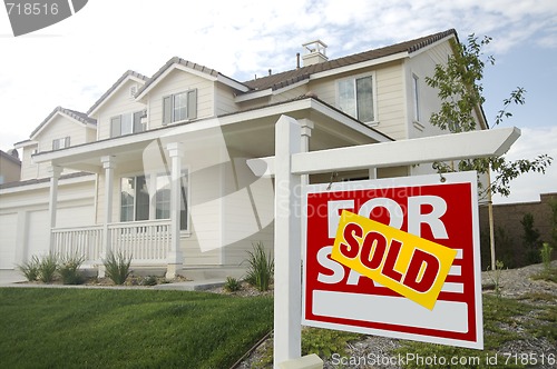 Image of Sold Home For Sale Sign in Front of New House 