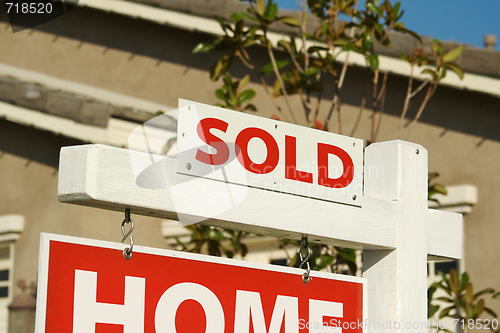 Image of Sold Home For Sale Sign & New House