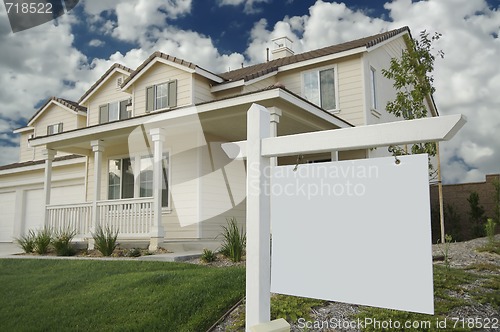 Image of Blank Real Estate Sign & New Home
