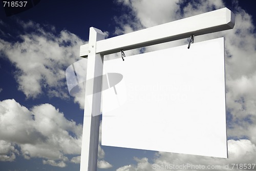 Image of Blank Real Estate Sign on Cloudy Sky 