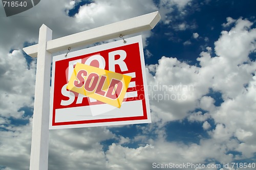 Image of Sold For Sale Real Estate Sign on Clouds