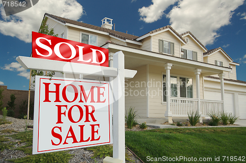 Image of Sold Home For Sale Sign & New House