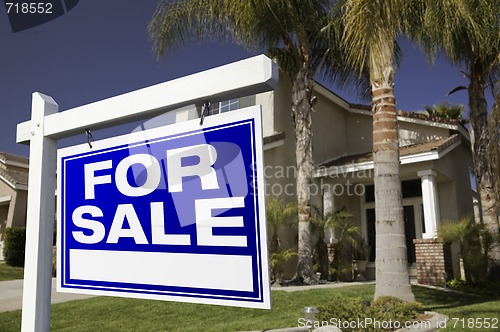 Image of For Sale Real Estate Sign and House