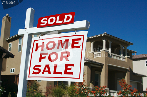 Image of Sold Home For Sale Sign & New House