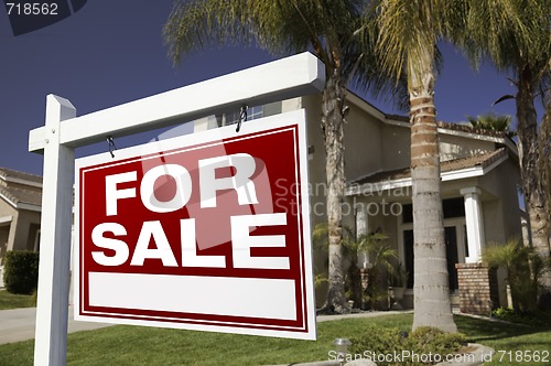 Image of For Sale Real Estate Sign and House