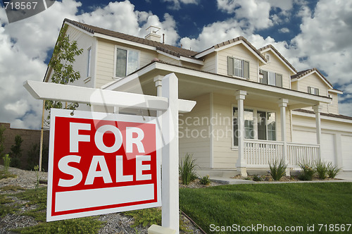 Image of Home For Sale Sign & New Home