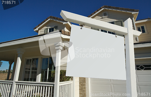 Image of Blank Real Estate Sign & New Home