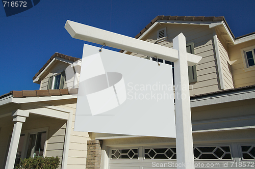 Image of Blank Real Estate Sign & New Home