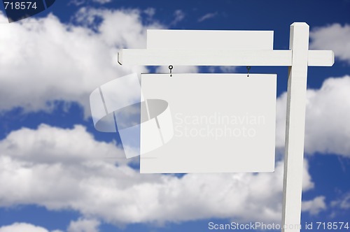 Image of Blank Real Estate Sign on Clouds & Sky Background 