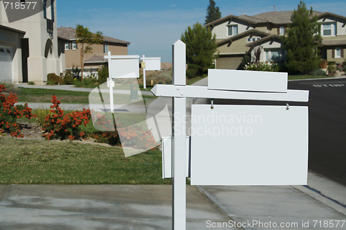 Image of Blank Real Estate Sign & New Home