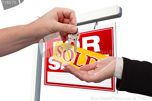 Image of Agent Handing Over the Key to a New Home