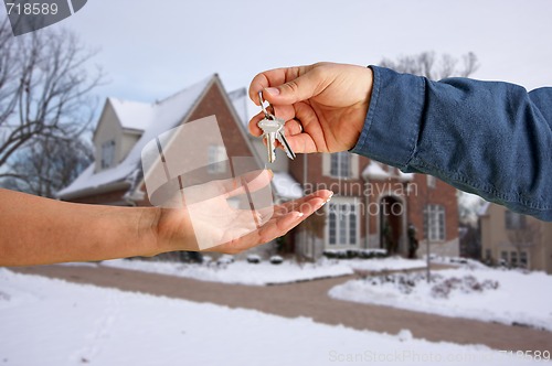 Image of Handing Over the House Keys in Front of New Home