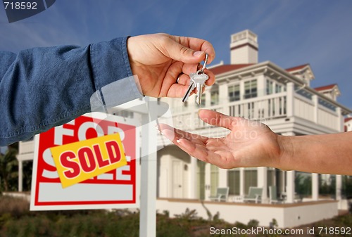 Image of Handing Over the House Keys in Front of New Home