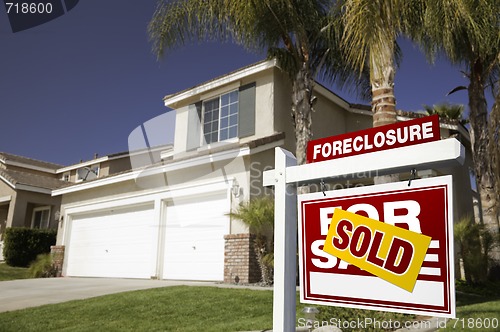 Image of Red Foreclosure For Sale Real Estate Sign and House