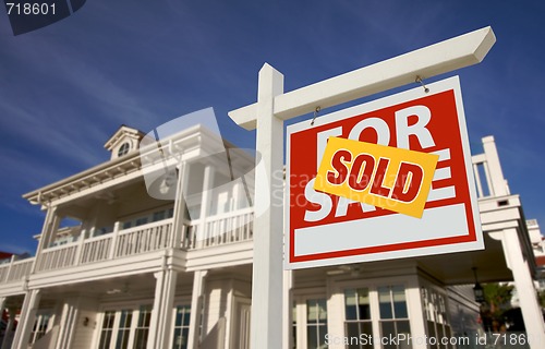 Image of Sold Home For Sale Sign in Front of New House 