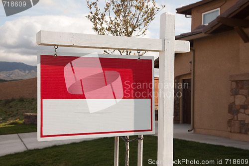 Image of Blank Real Estate Sign in Front of House